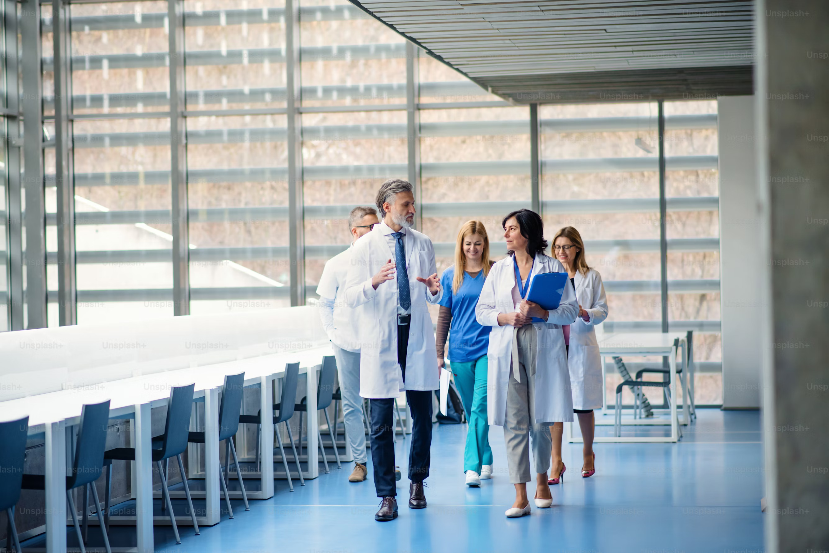 medical staff walking in a facility having a conversation